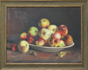 Still life painting of apples piled on a plate against a dark background, inside a gilded ornate frame.